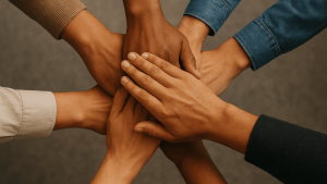 Hands placed on top of each other as a team